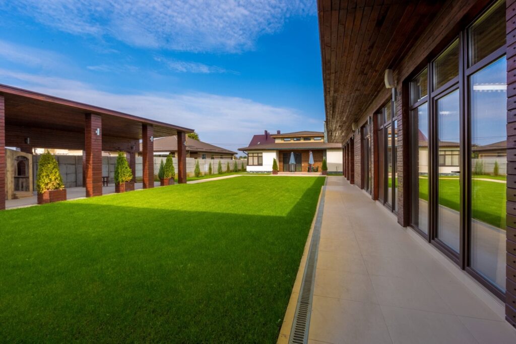 A green lawn in a home's courtyard